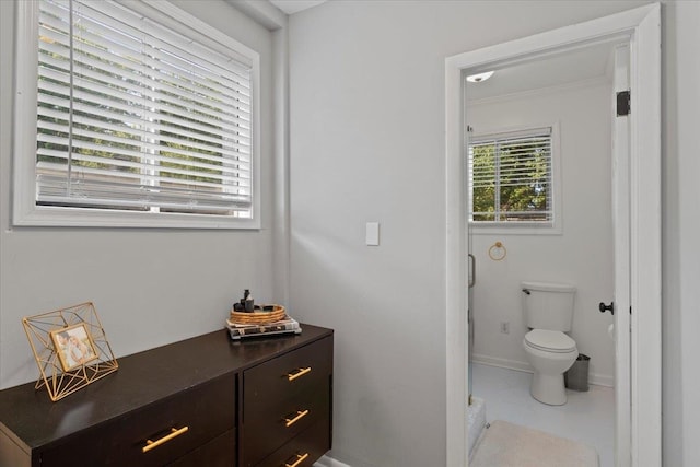 bathroom with tile patterned flooring and toilet