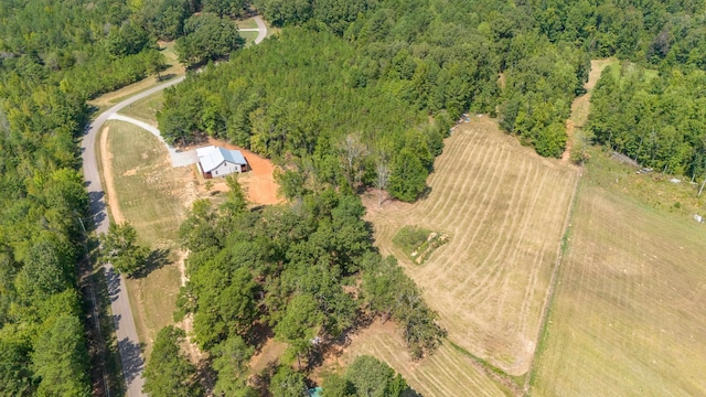 birds eye view of property with a forest view