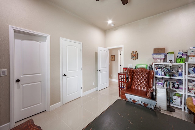 office space with ceiling fan and light tile patterned floors