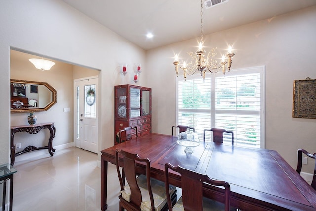 dining room with a notable chandelier