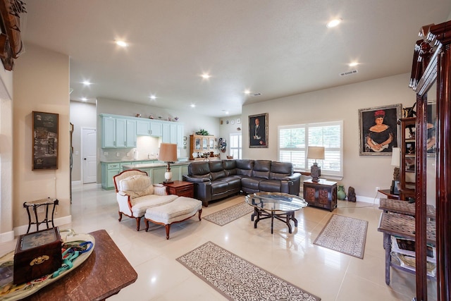 living room with light tile patterned flooring