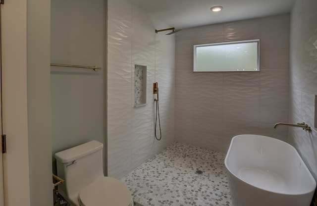 bathroom with toilet and a tile shower