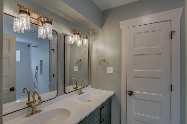 bathroom with walk in shower and vanity