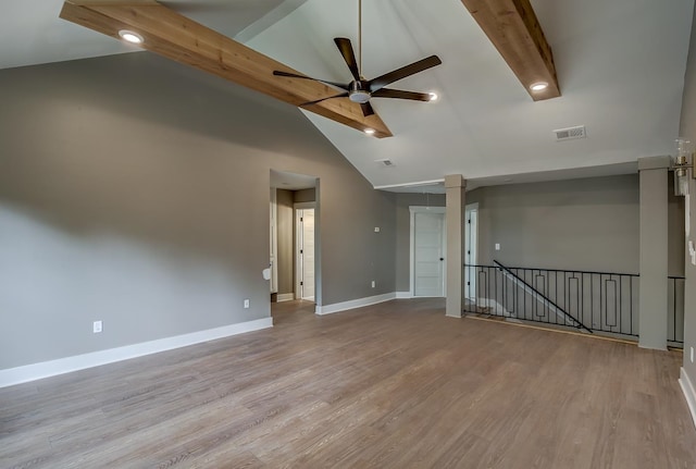 empty room with light hardwood / wood-style flooring, ceiling fan, and high vaulted ceiling