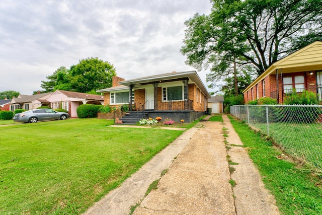 view of front of home with a front lawn and covered porch