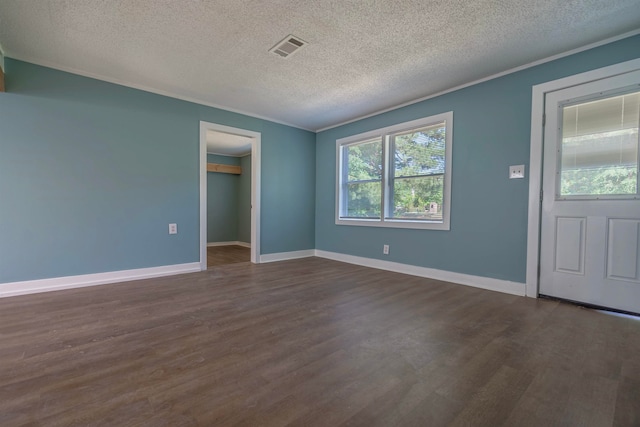 unfurnished room with a textured ceiling and dark hardwood / wood-style floors