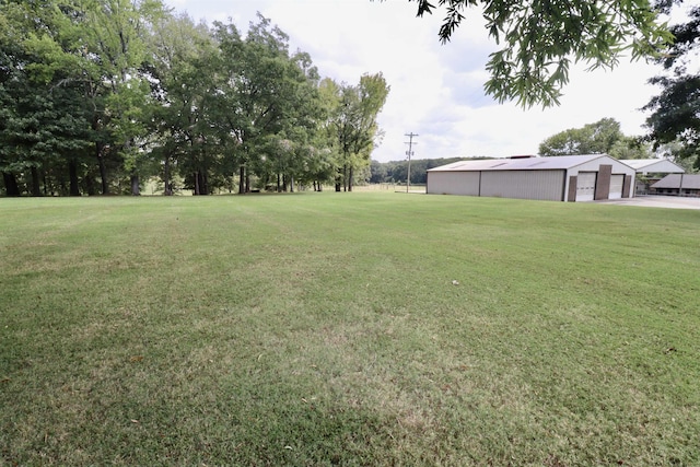 0 Old Brownsville Rd, Ripley, TN 38063 - view of yard with a detached garage and an outbuilding