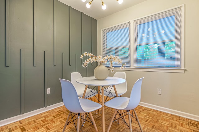 dining area featuring light parquet flooring