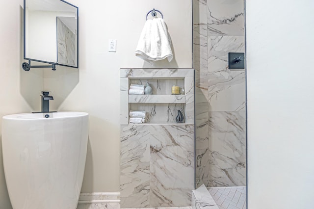 bathroom with a tile shower