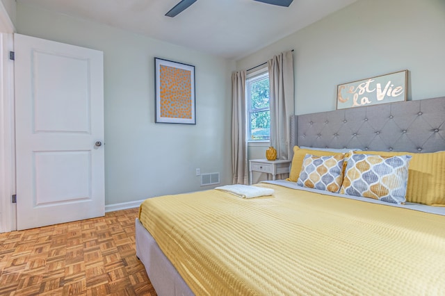 bedroom featuring parquet floors and ceiling fan