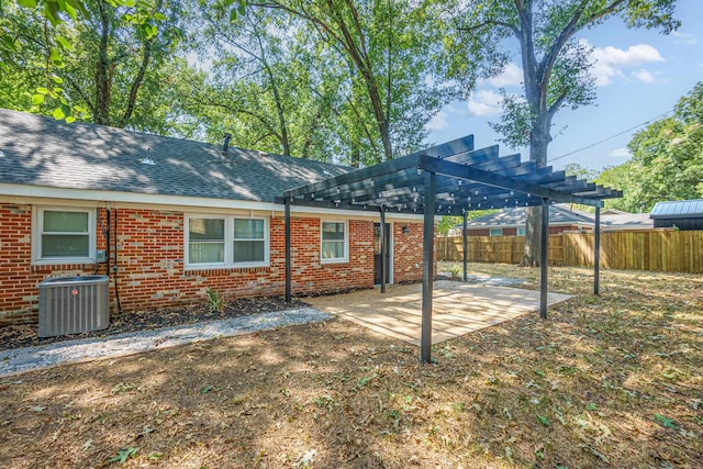 back of house featuring a pergola, a patio area, and cooling unit