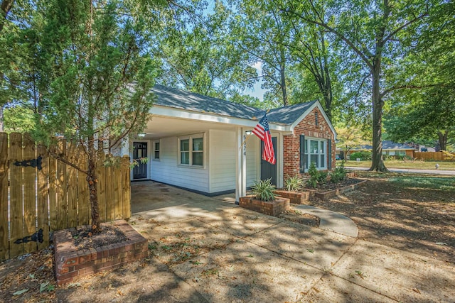 view of front facade with a carport