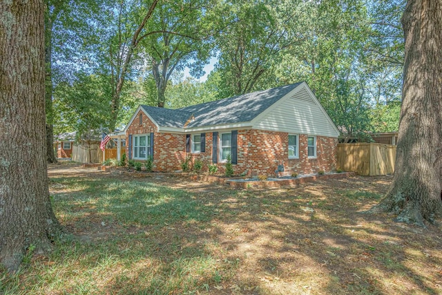 ranch-style home with a front lawn