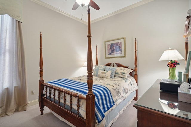 carpeted bedroom featuring ceiling fan and ornamental molding