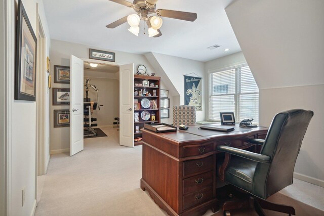 office area featuring ceiling fan and light carpet