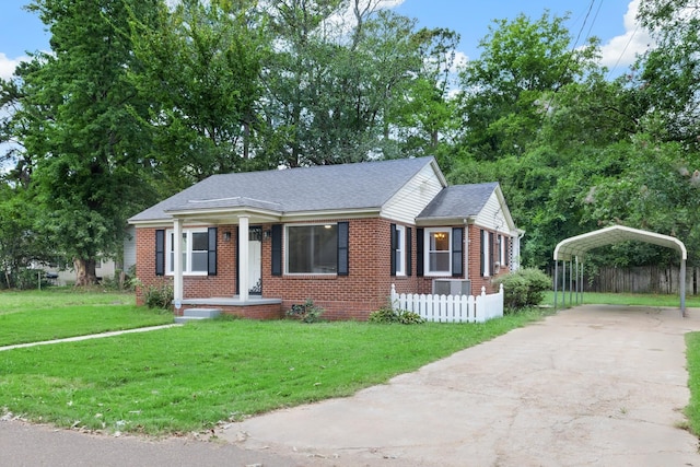 view of front facade featuring a front yard, central AC unit, and a carport