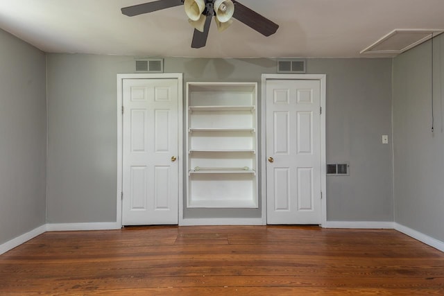 unfurnished bedroom with ceiling fan and hardwood / wood-style floors