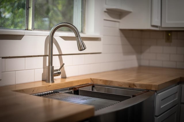 kitchen featuring sink and wood counters