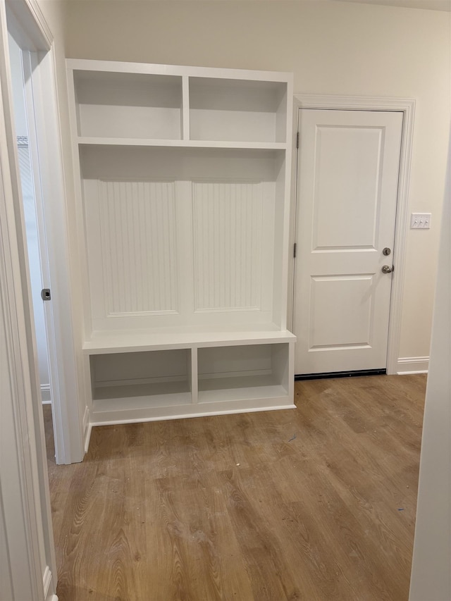 mudroom with wood-type flooring