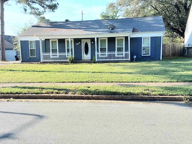 ranch-style house with a front yard and a porch