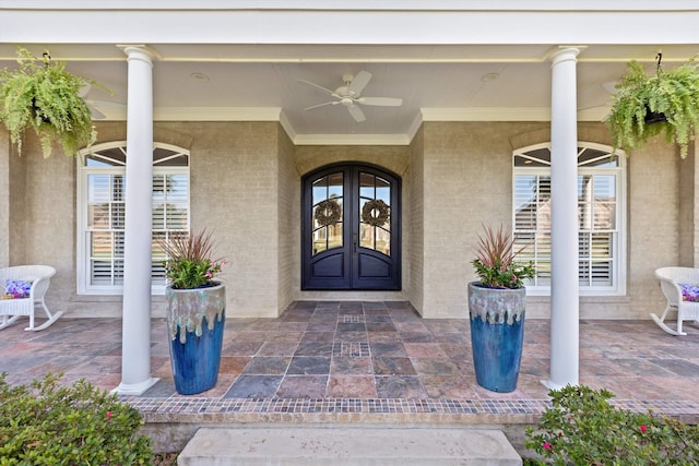 property entrance with ceiling fan and french doors