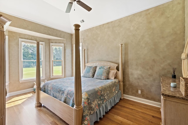 bedroom with ceiling fan and hardwood / wood-style flooring