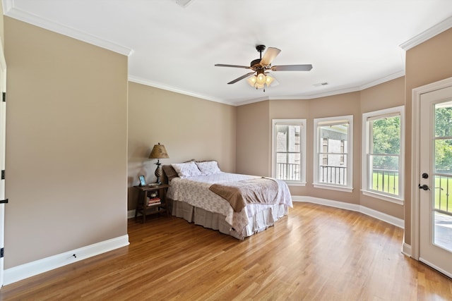 bedroom with light wood-type flooring, ceiling fan, access to exterior, and crown molding