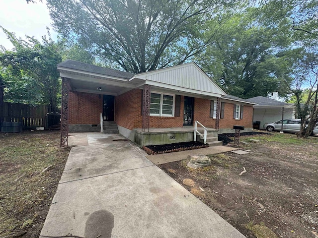 single story home featuring a carport