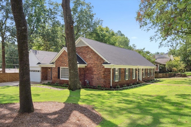 view of front of house with a garage and a front lawn