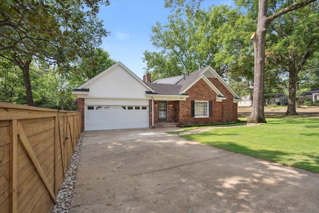 view of front of property featuring a garage and a front yard