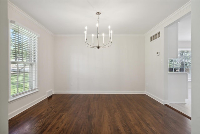 spare room with ornamental molding, a chandelier, and dark hardwood / wood-style floors