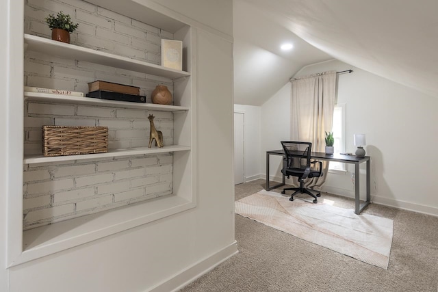 office area featuring carpet flooring and vaulted ceiling