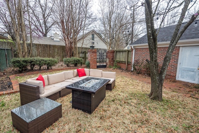 view of yard featuring an outdoor living space with a fire pit