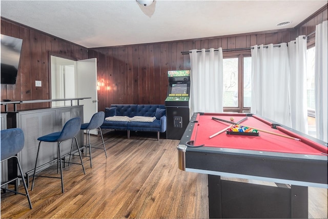 recreation room with billiards, wooden walls, and wood-type flooring