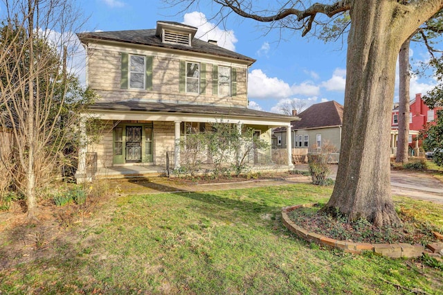 view of front of house featuring a porch and a front yard