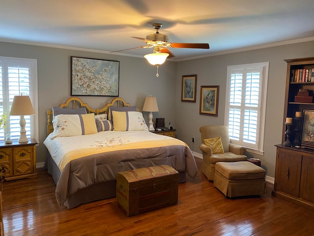 bedroom with crown molding, hardwood / wood-style floors, and ceiling fan