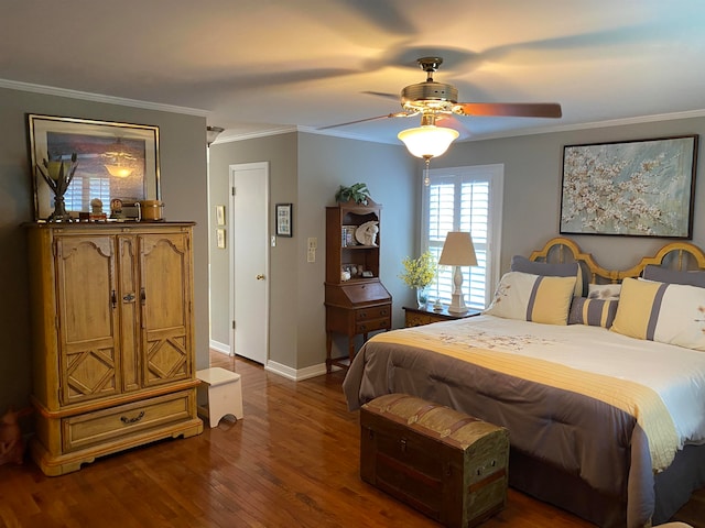 bedroom featuring ceiling fan, dark hardwood / wood-style flooring, and crown molding