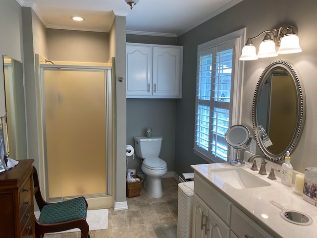 bathroom featuring vanity, toilet, ornamental molding, and an enclosed shower