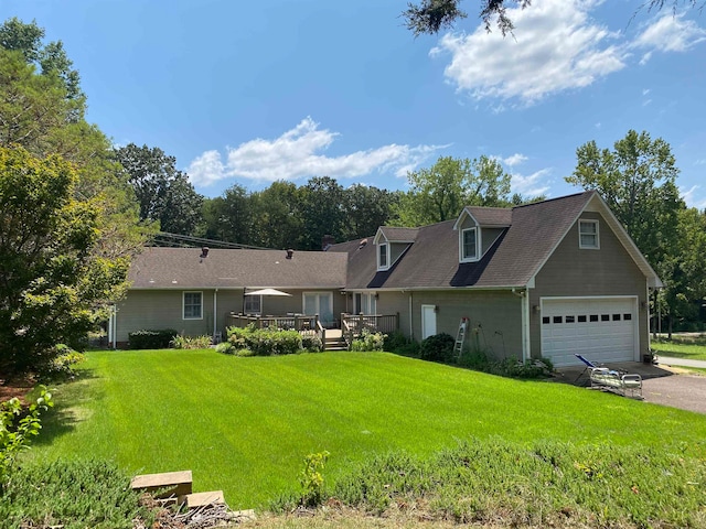 cape cod house featuring a front yard, a garage, and a deck