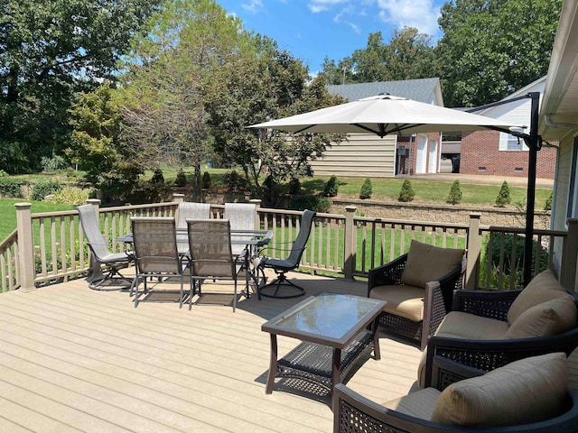 wooden terrace with a yard