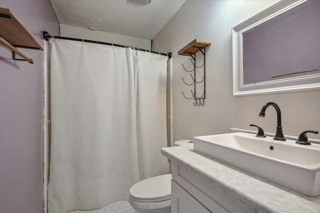 bathroom featuring curtained shower, toilet, a textured ceiling, and vanity