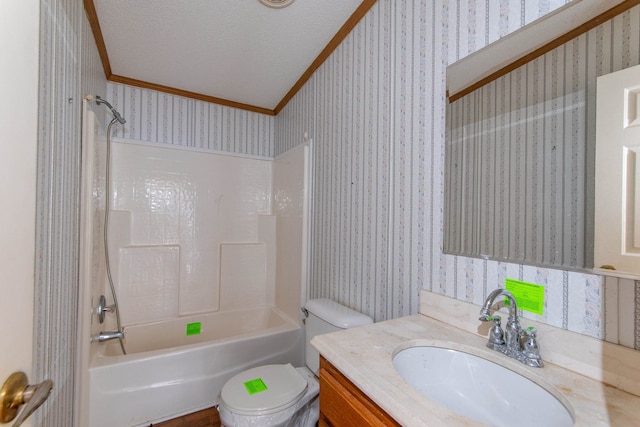 full bathroom featuring crown molding, bathtub / shower combination, toilet, vanity, and a textured ceiling