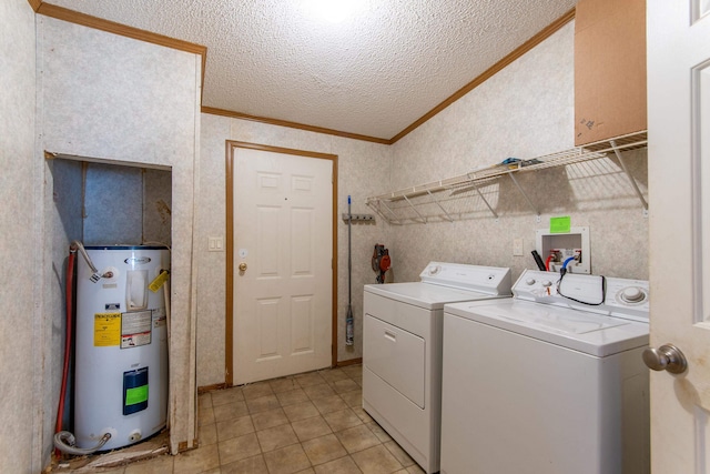 laundry room with a textured ceiling, light tile patterned floors, water heater, crown molding, and washing machine and dryer