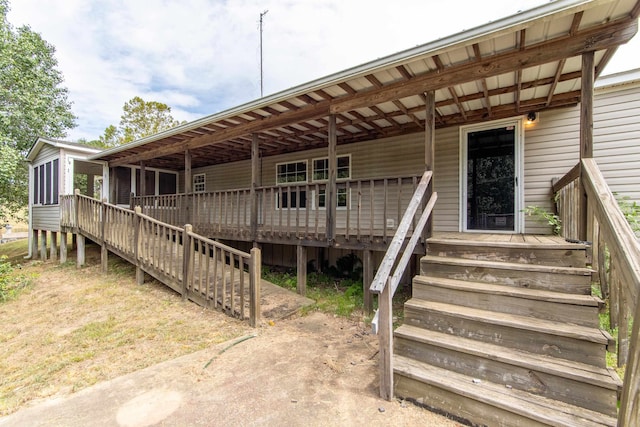 entrance to property featuring a deck