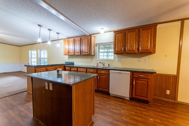 kitchen with hanging light fixtures, dishwasher, a center island, dark hardwood / wood-style flooring, and a textured ceiling