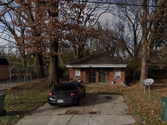 bungalow-style home with an outbuilding