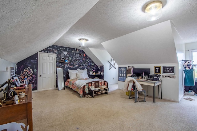 carpeted bedroom featuring a textured ceiling and lofted ceiling