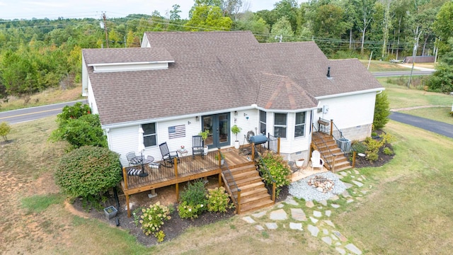 exterior space featuring a lawn and a deck