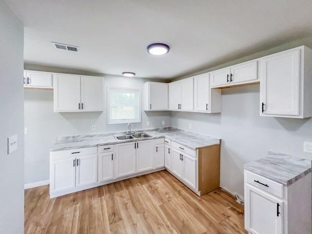 kitchen featuring white cabinets