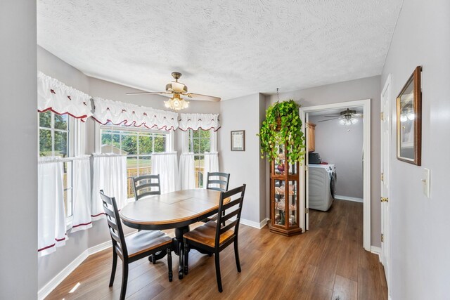 dining area with washer / dryer, ceiling fan, hardwood / wood-style flooring, and a textured ceiling